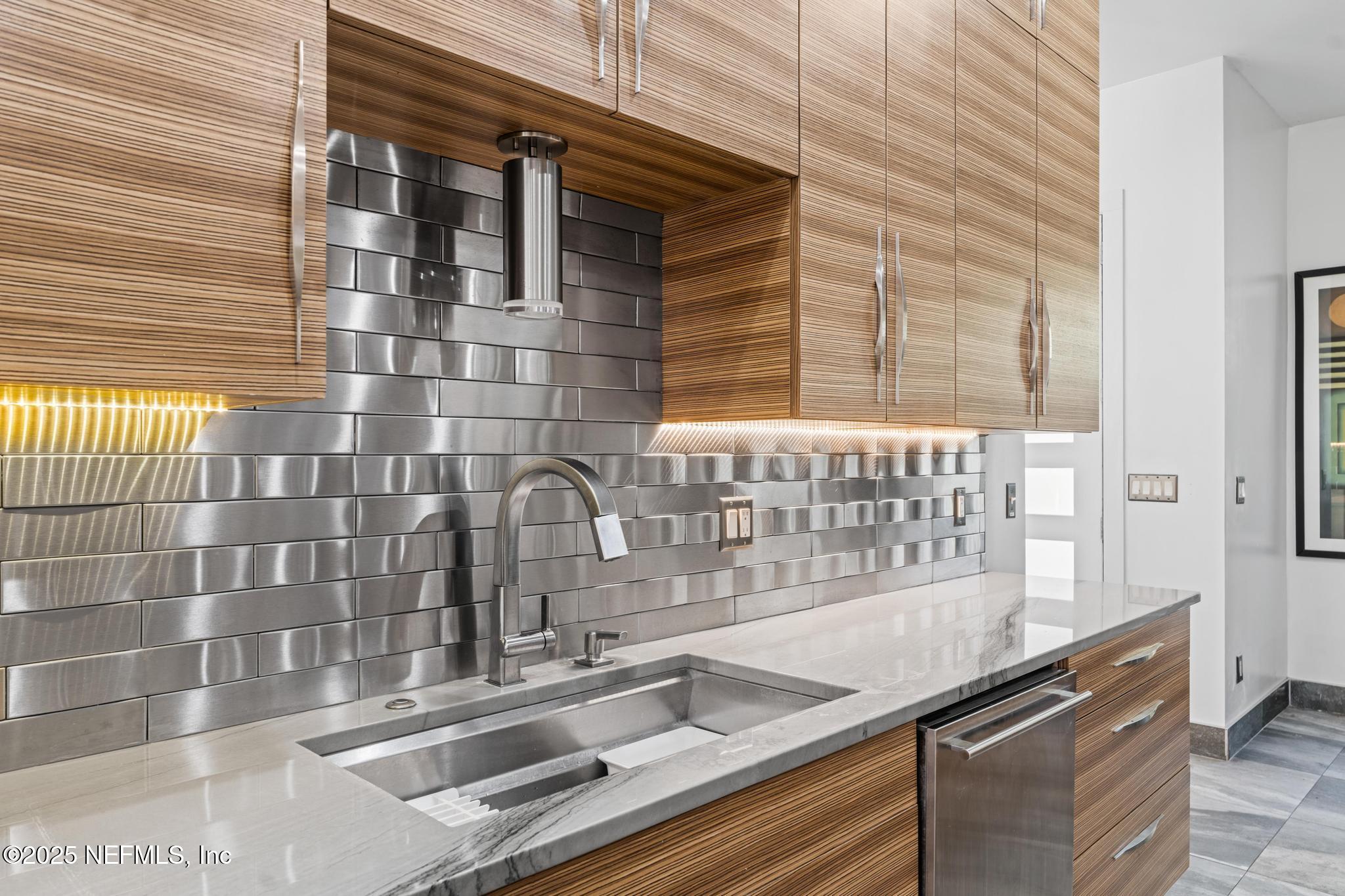 3010 Starratt Road Jacksonville, FL 32226 - Photo 32 of 106 a kitchen with granite countertop a sink and a window