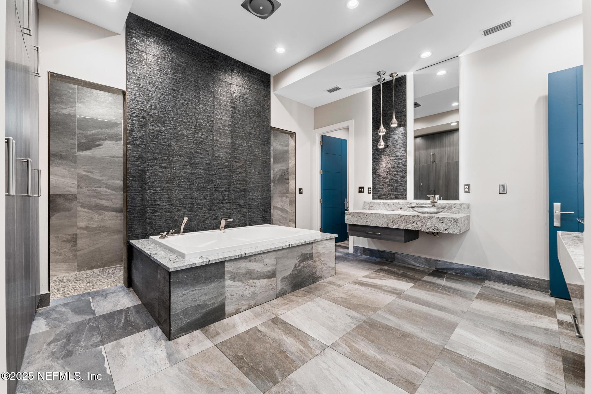 3010 Starratt Road Jacksonville, FL 32226 - Photo 48 of 106 a spacious bathroom with a tub shower and sink