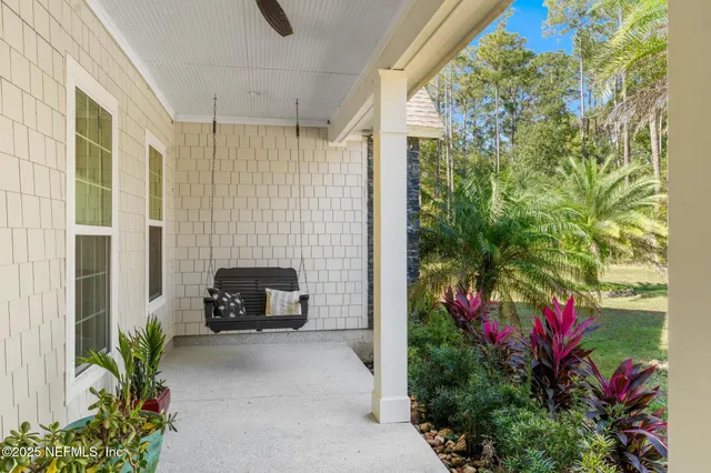 an aerial view of a house with a swimming pool