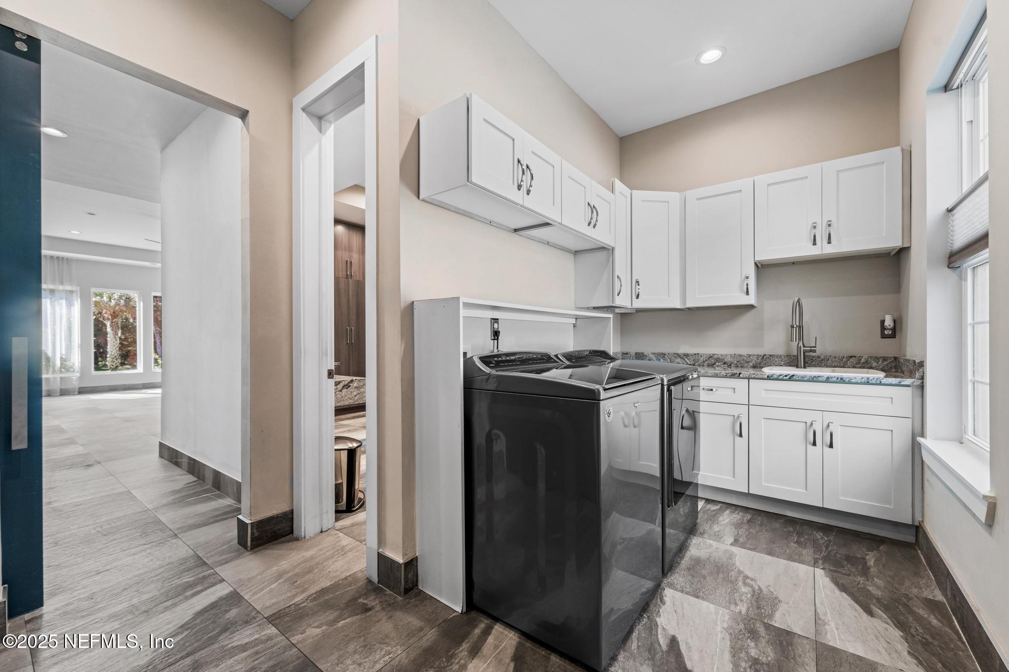 3010 Starratt Road Jacksonville, FL 32226 - Photo 51 of 106 a kitchen with stainless steel appliances granite countertop a refrigerator a stove and a sink