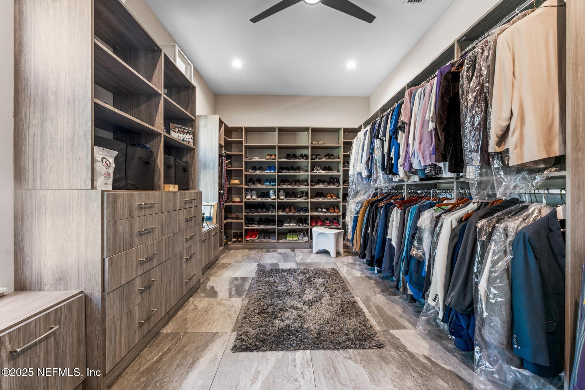 3010 Starratt Road Jacksonville, FL 32226 - Photo 52 of 106 a view of walk in closet with clothes and shoes