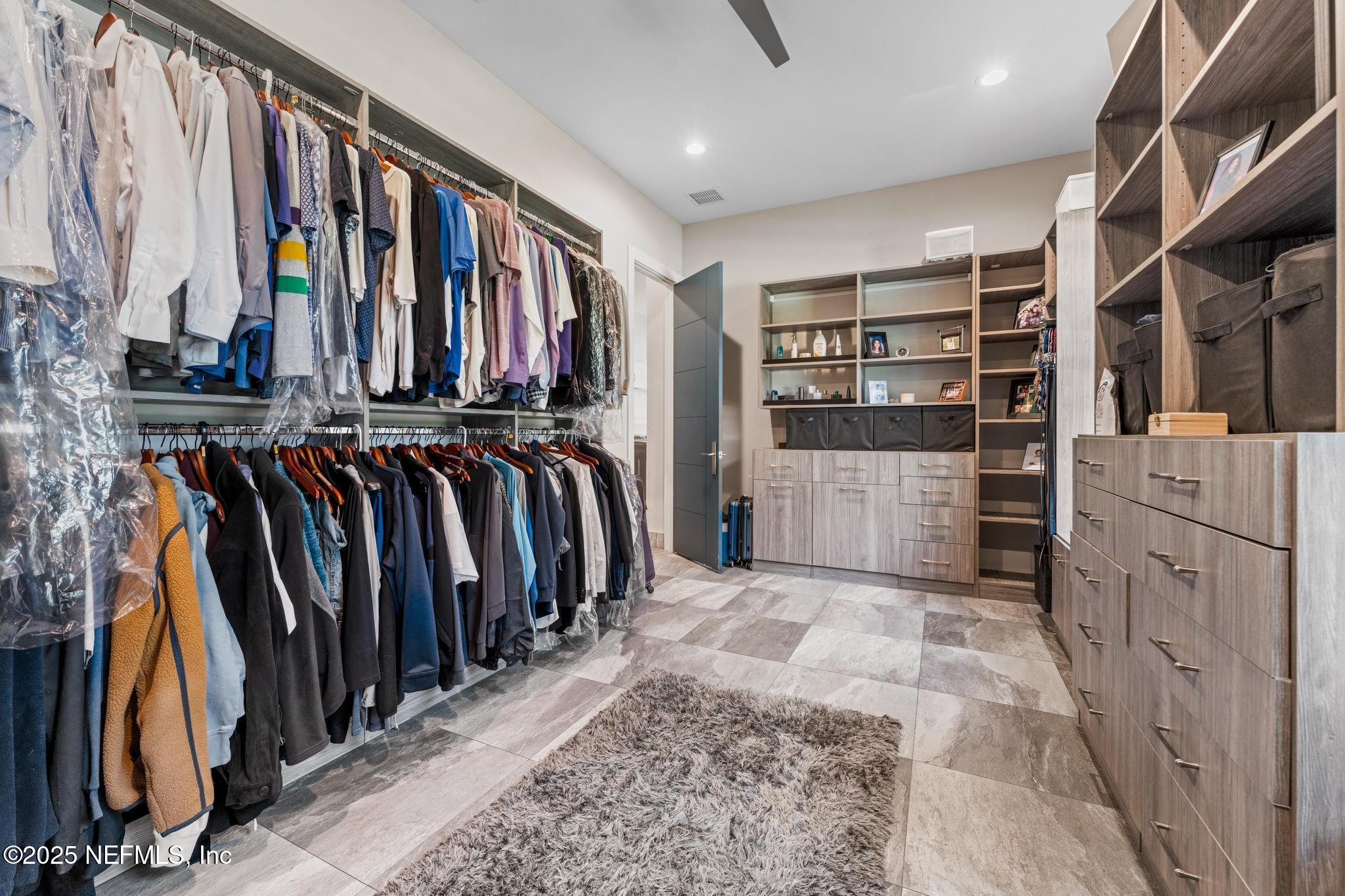 3010 Starratt Road Jacksonville, FL 32226 - Photo 53 of 106 a view of walk in closet with clothes and shoes