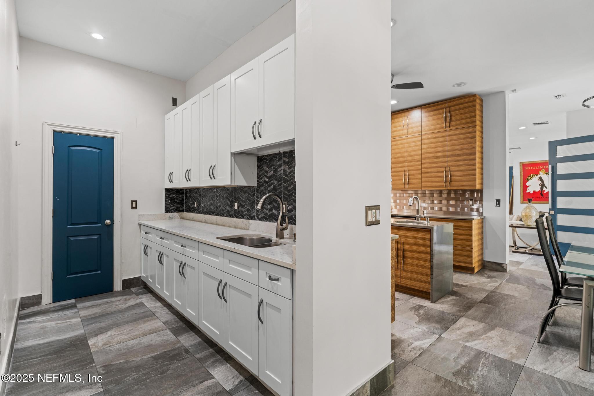 3010 Starratt Road Jacksonville, FL 32226 - Photo 56 of 106 a kitchen with stainless steel appliances kitchen island granite countertop a refrigerator and a stove top oven