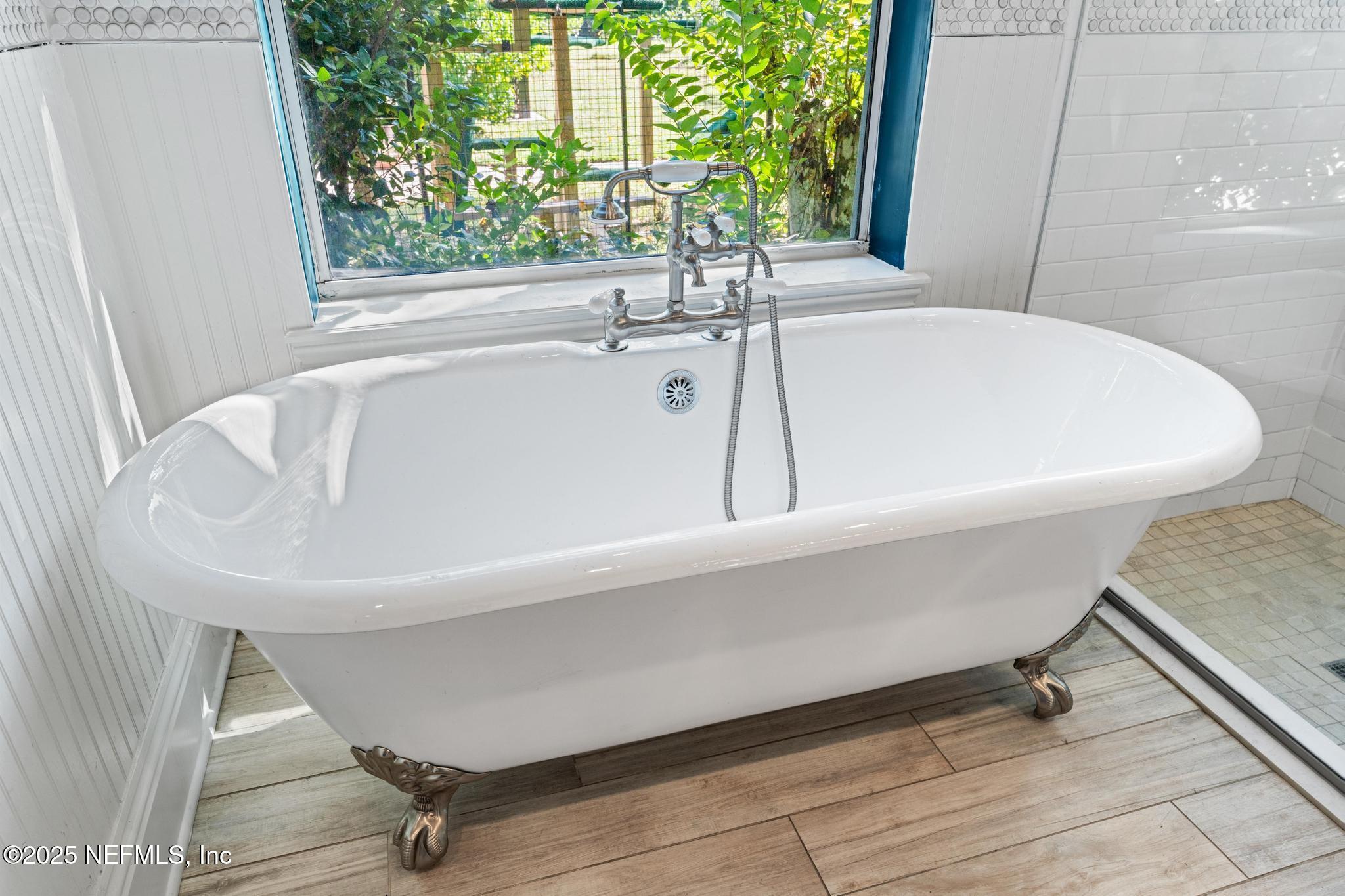 3010 Starratt Road Jacksonville, FL 32226 - Photo 60 of 106 a white bath tub sitting in a bathroom