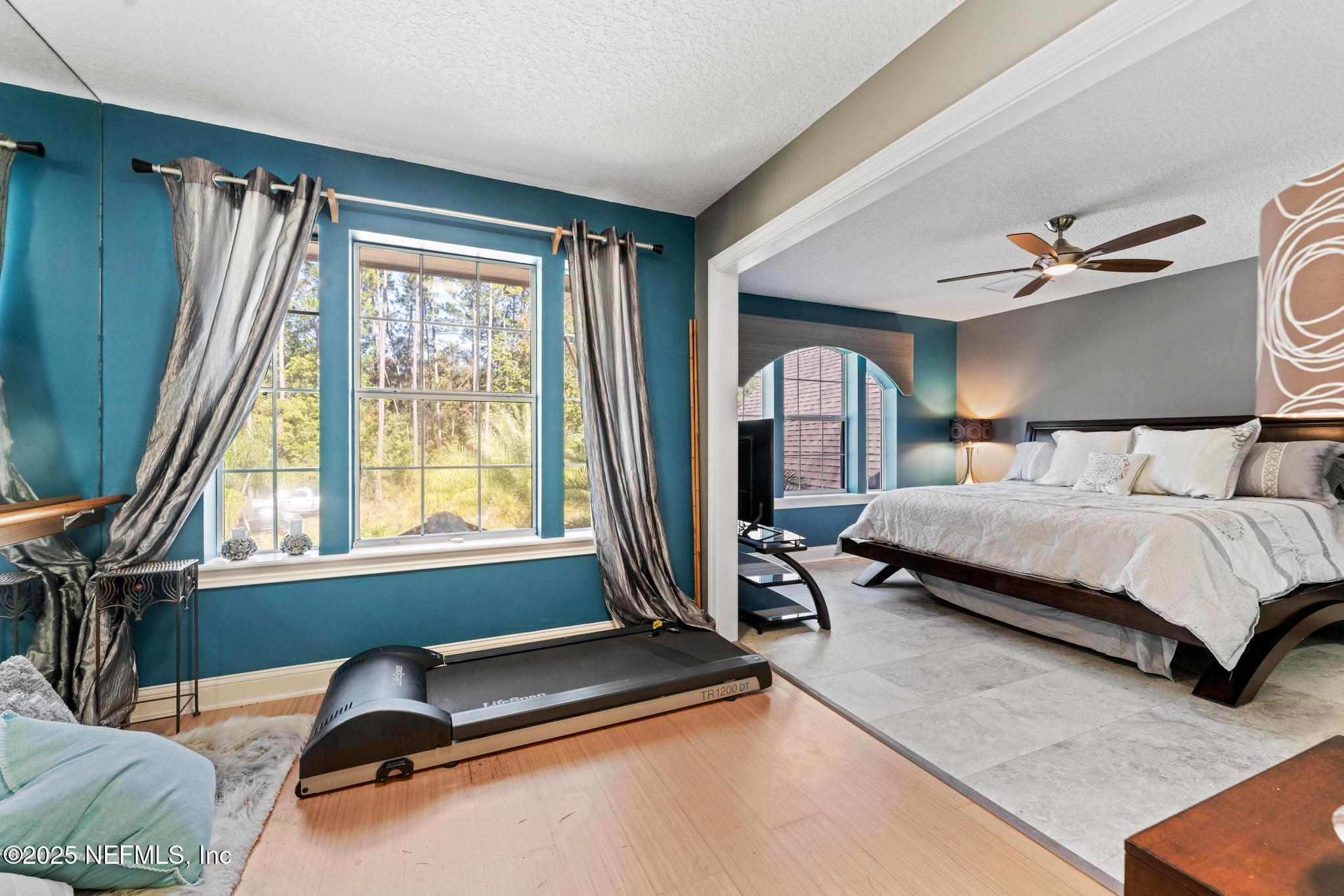 3010 Starratt Road Jacksonville, FL 32226 - Photo 69 of 106 a bedroom with a bed couch and a window