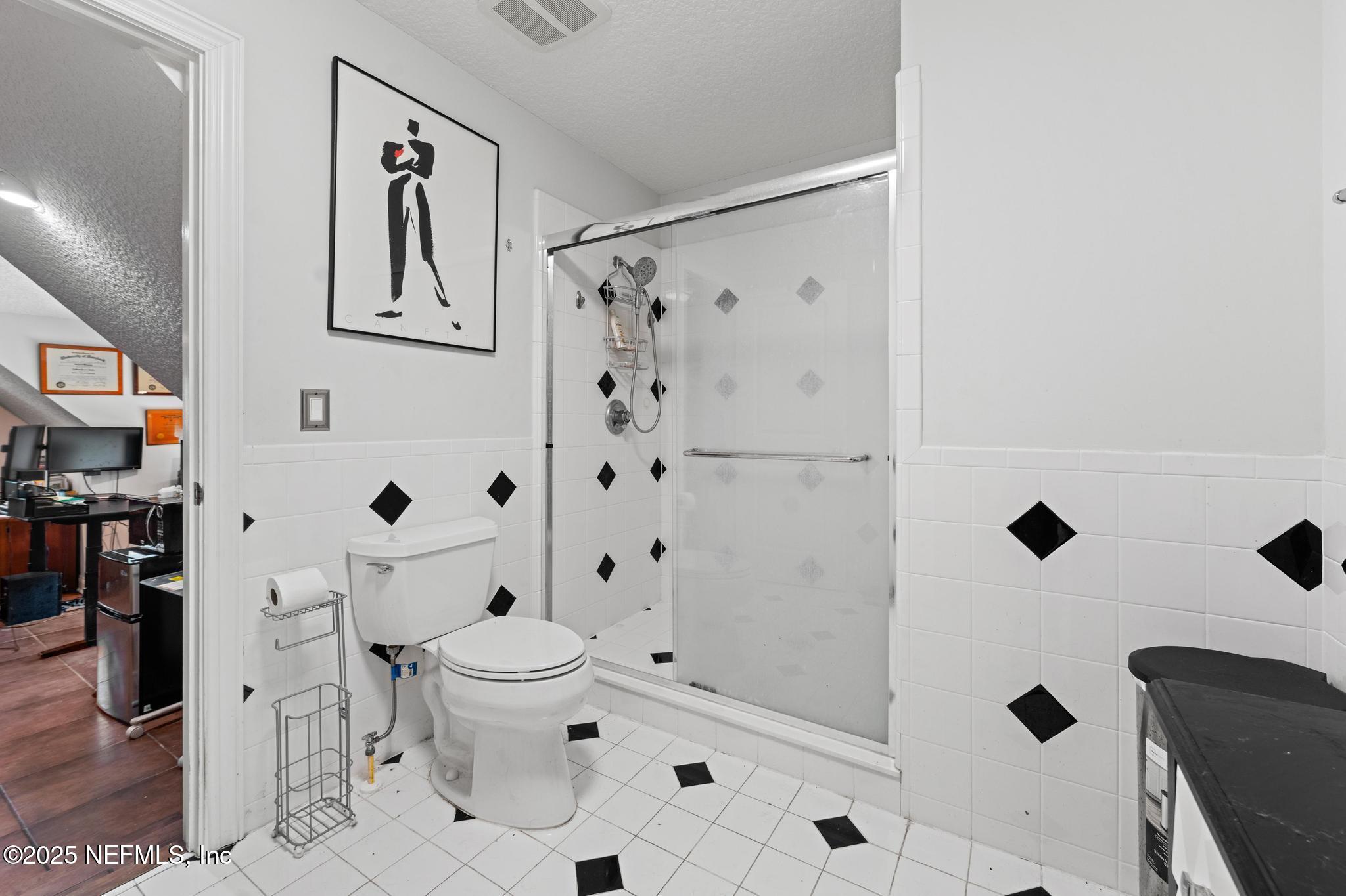 3010 Starratt Road Jacksonville, FL 32226 - Photo 74 of 106 a bathroom with a toilet and a shower