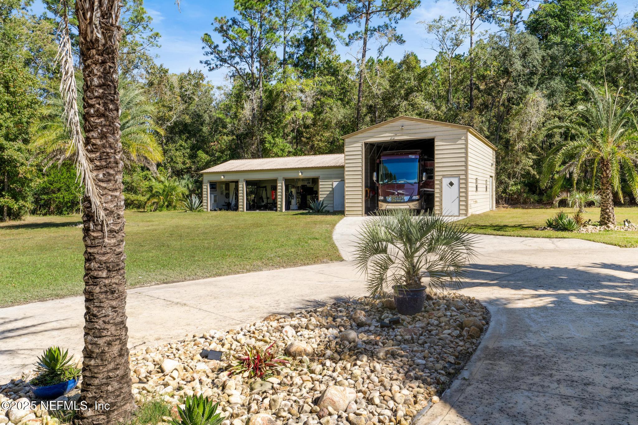 3010 Starratt Road Jacksonville, FL 32226 - Photo 84 of 106 a view of a house with backyard and sitting area