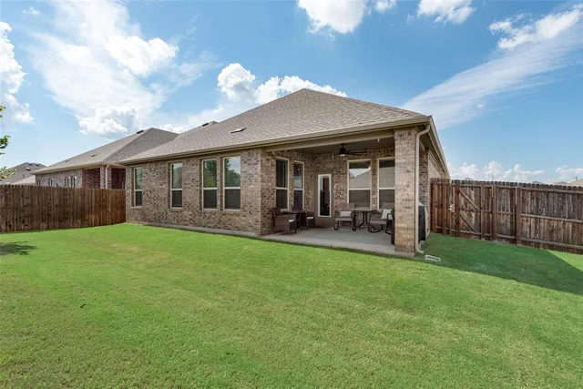 a view of a house with backyard porch and garden