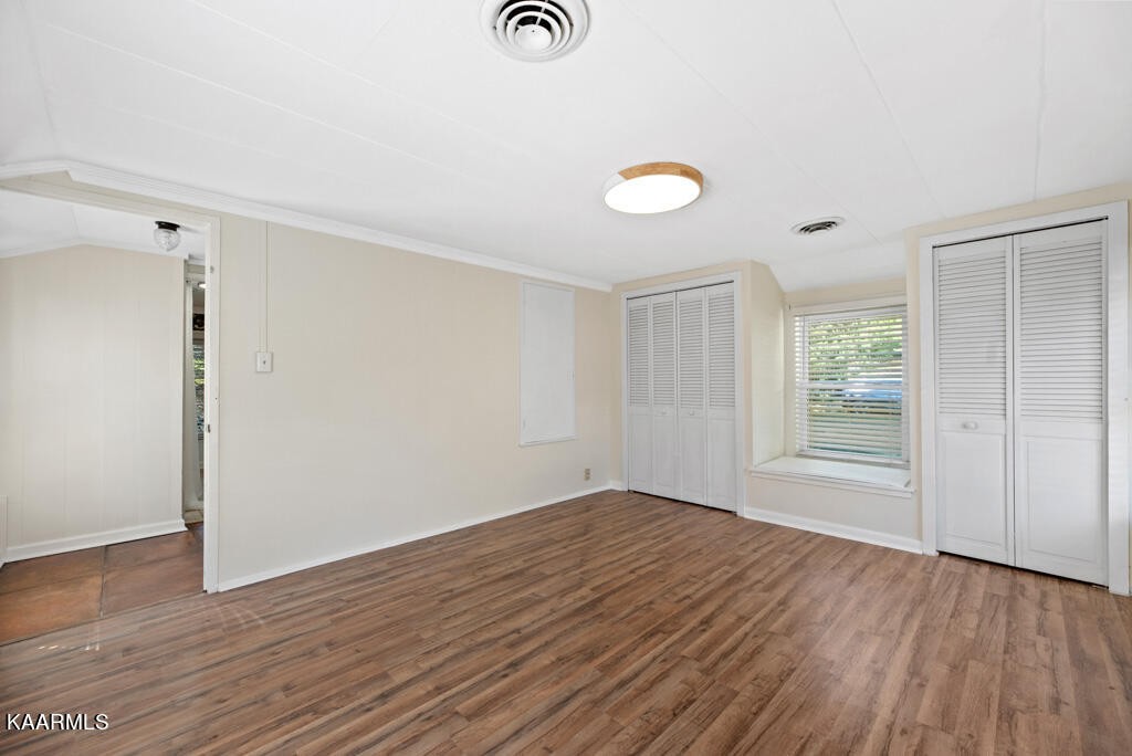 171 Garden Road Norris, TN 37828 - Photo 14 of 33 an empty room with wooden floor and windows