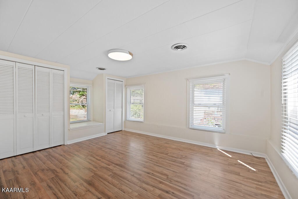 171 Garden Road Norris, TN 37828 - Photo 15 of 33 a view of an empty room with wooden floor and a window