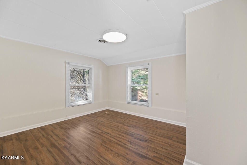 171 Garden Road Norris, TN 37828 - Photo 18 of 33 a view of an empty room with wooden floor and a window