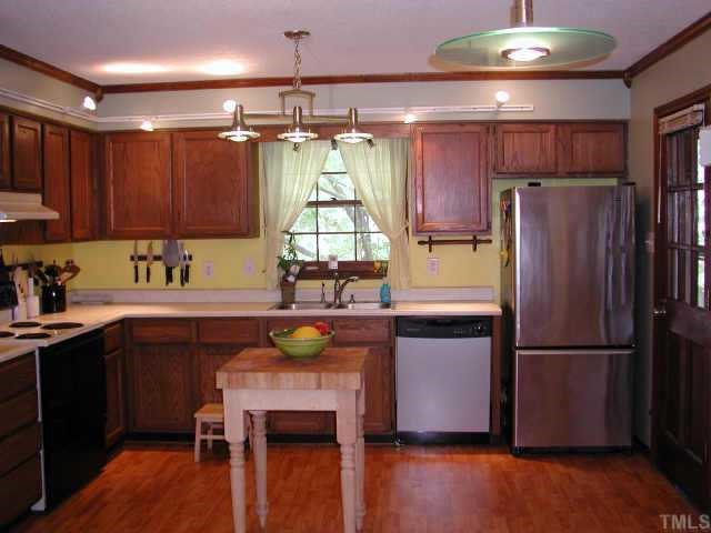 1413 Princess Anne Road Raleigh, NC 27607 - Photo 2 of 7 a kitchen with a refrigerator and a sink