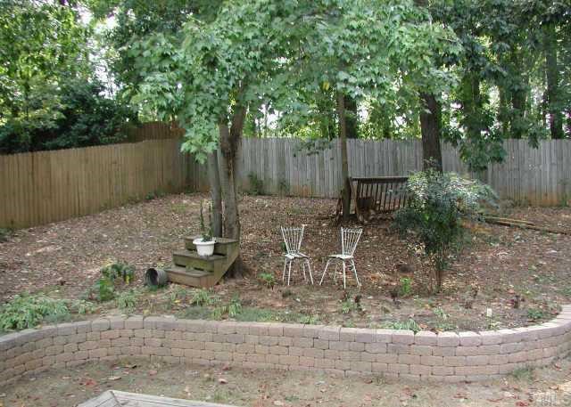 1413 Princess Anne Road Raleigh, NC 27607 - Photo 5 of 7 a backyard of a house with lots of green space