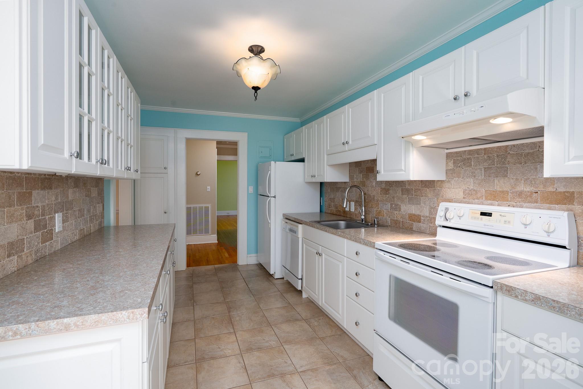 541 Union Street South Concord, NC 28025 - Photo 11 of 29 a kitchen with cabinets and window