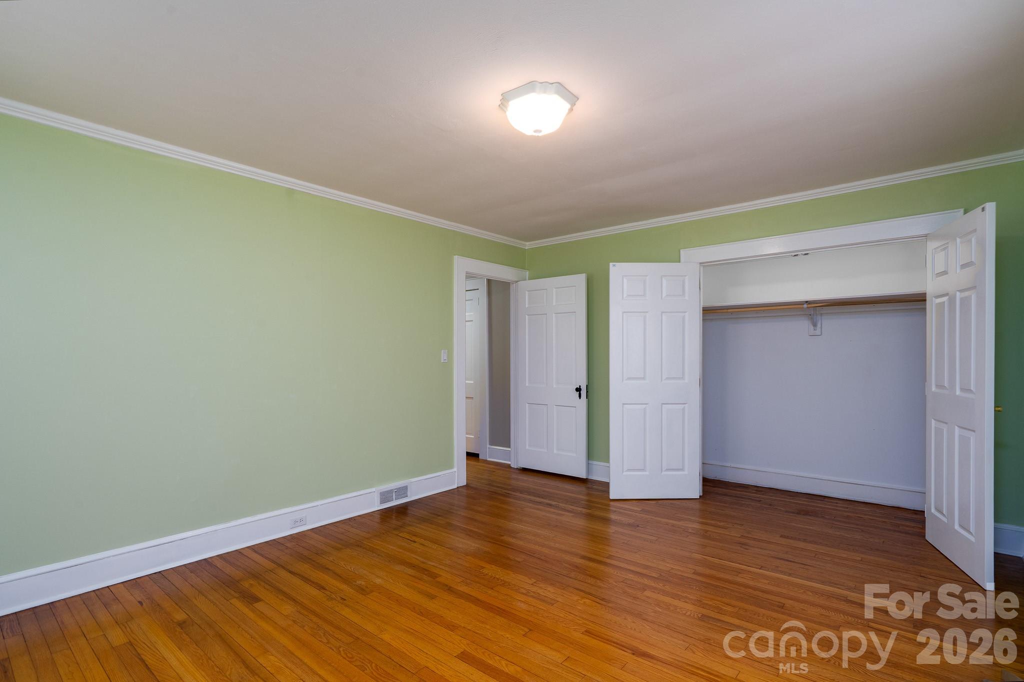 541 Union Street South Concord, NC 28025 - Photo 15 of 29 an empty room with wooden floor and closet