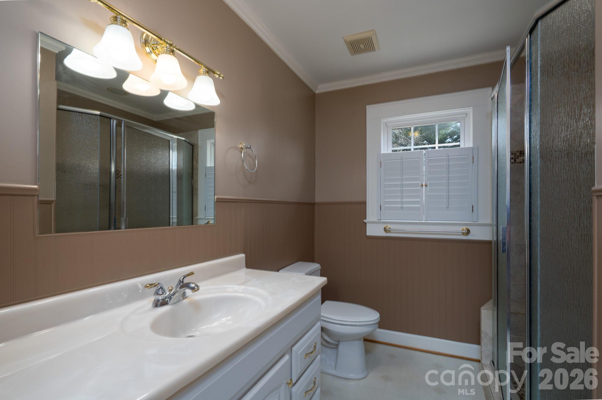 541 Union Street South Concord, NC 28025 - Photo 16 of 29 a bathroom with a sink a toilet and a mirror