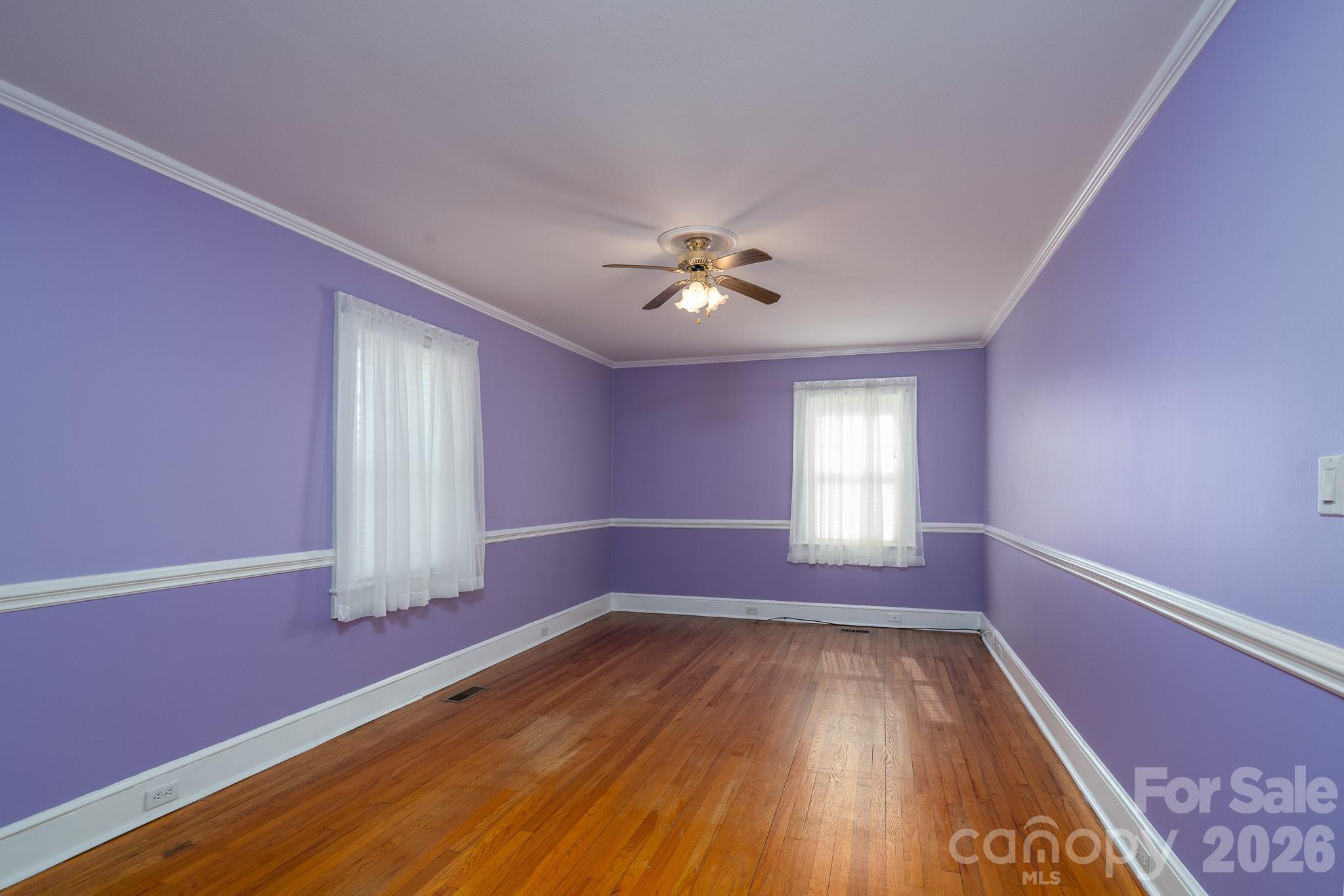 541 Union Street South Concord, NC 28025 - Photo 20 of 29 a view of empty room with wooden floor and fan