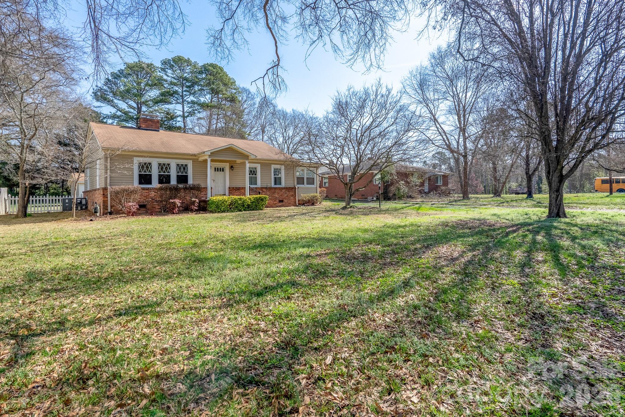 541 Union Street South Concord, NC 28025 - Photo 24 of 29 a front view of a house with a yard and trees