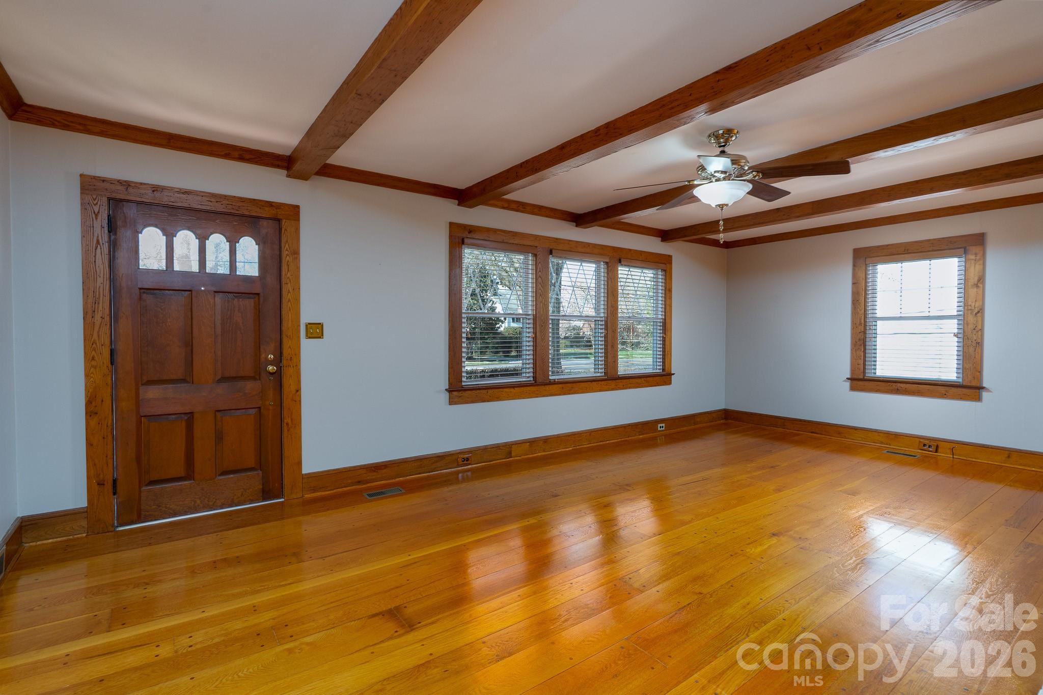 541 Union Street South Concord, NC 28025 - Photo 4 of 29 a view of an empty room with window and wooden floor