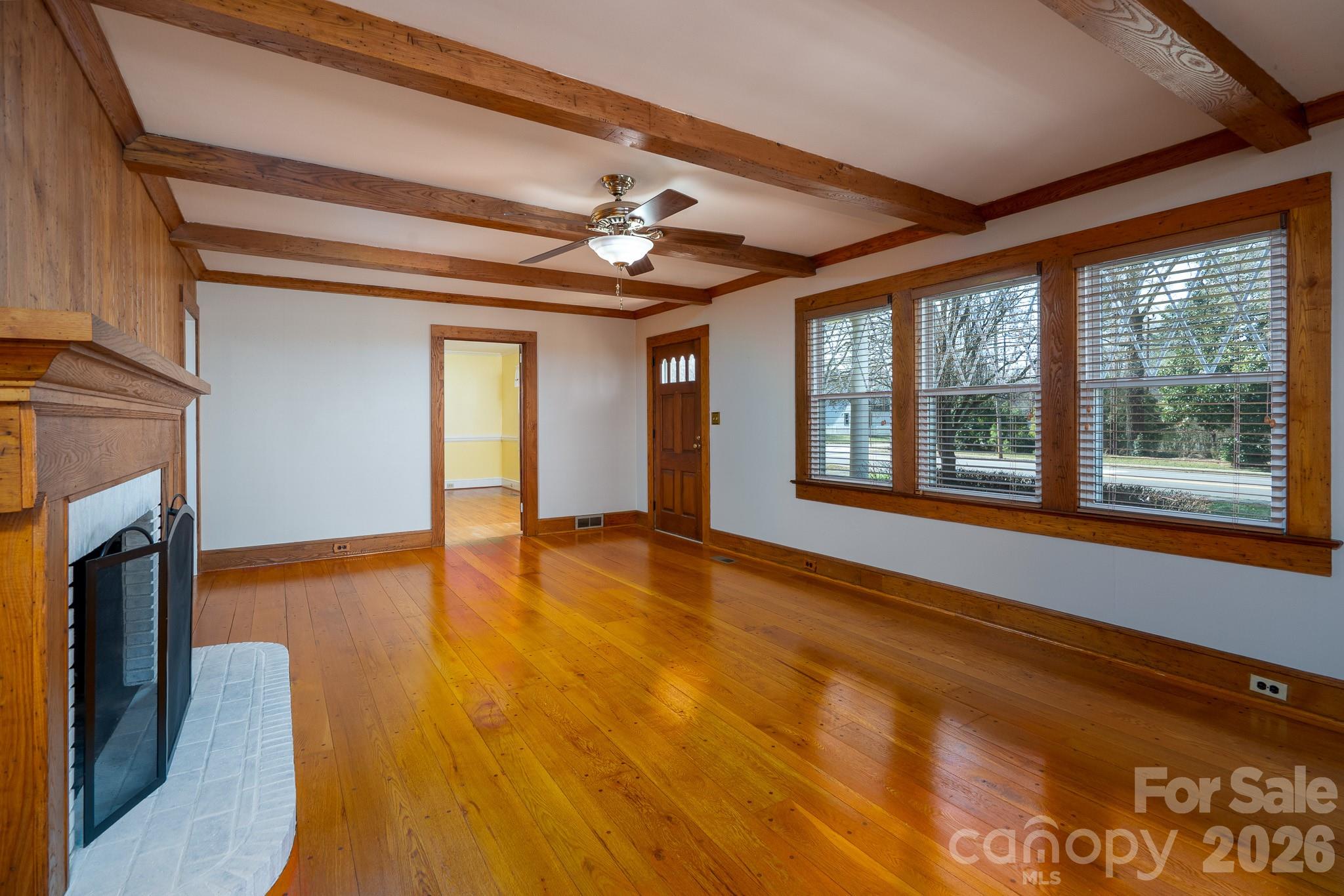 541 Union Street South Concord, NC 28025 - Photo 7 of 29 a view of an empty room with window and wooden floor