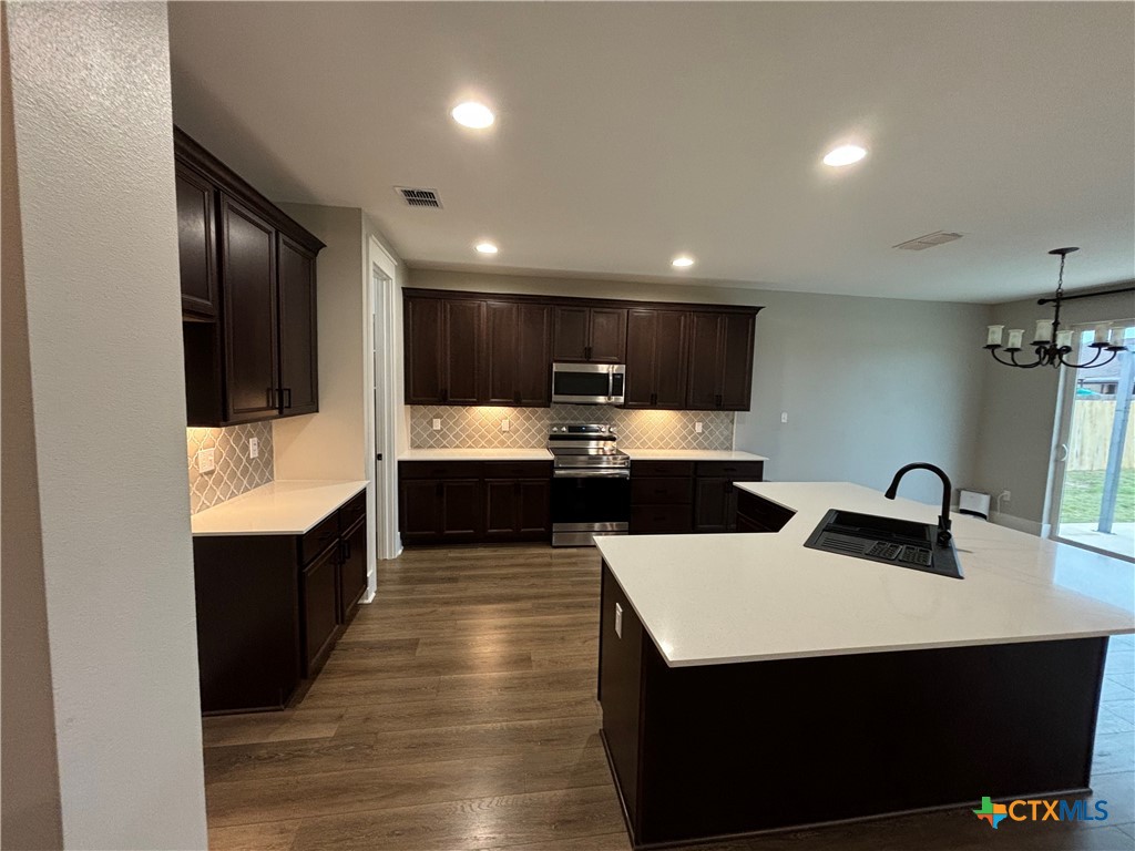110 Hiram Cook Blanco, TX 78606 - Photo 27 of 46 a kitchen with a sink stainless steel appliances and white cabinets