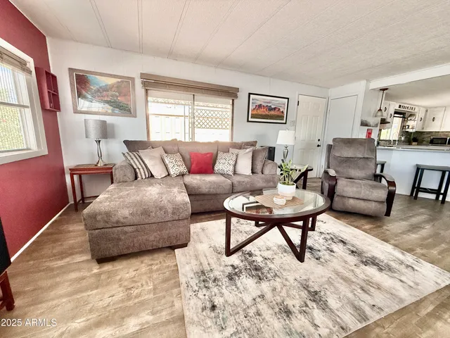 a living room with furniture and a rug