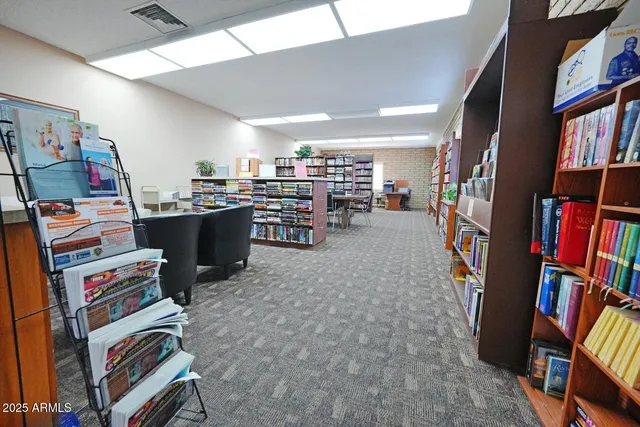 a room with furniture and a book shelf