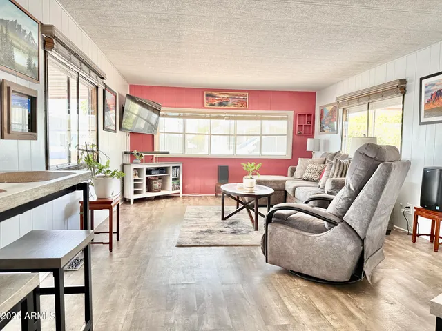 a picture of a room with a white refrigerator and a stove