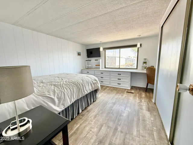 a kitchen with stainless steel appliances a stove refrigerator and cabinets