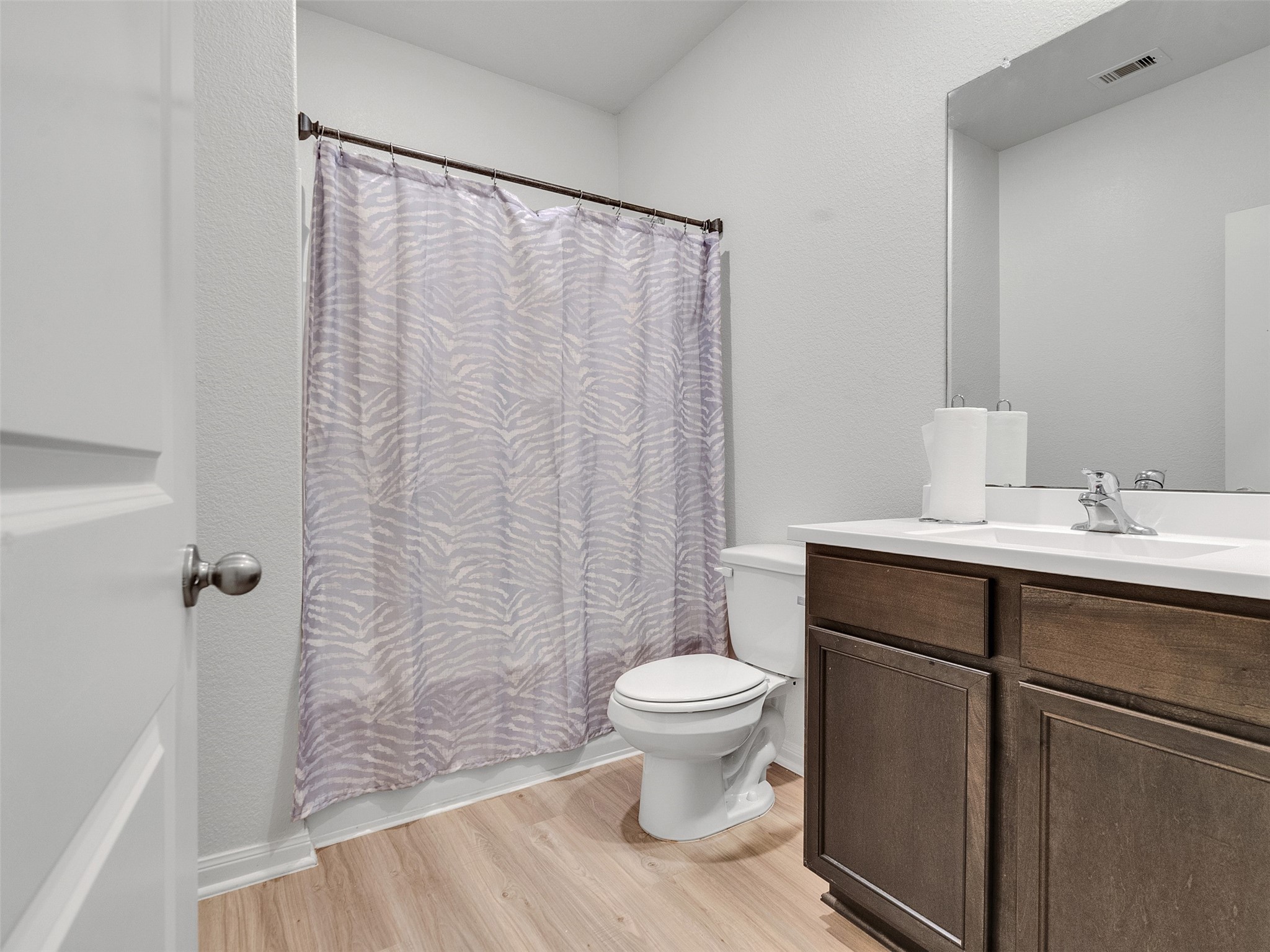 2123 Mule Ridge Drive Katy, TX 77493 - Photo 15 of 22 a bathroom with a sink a toilet a mirror and shower