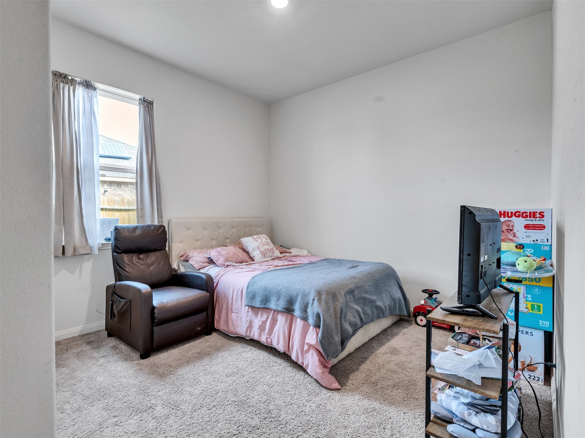 2123 Mule Ridge Drive Katy, TX 77493 - Photo 16 of 22 a bedroom with a bed and a couch