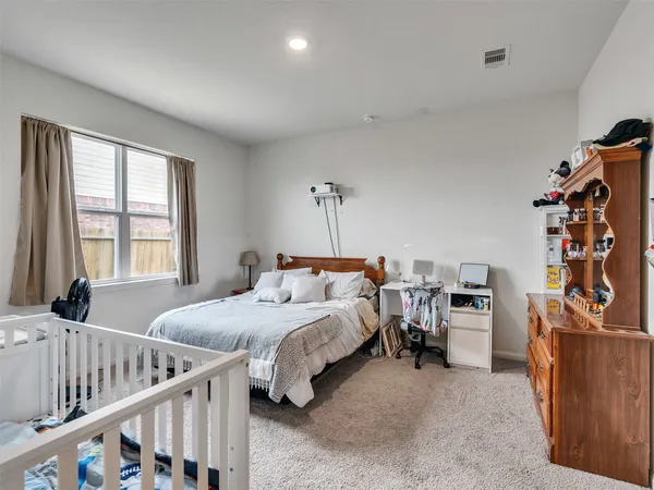 a bed room with furniture and a window