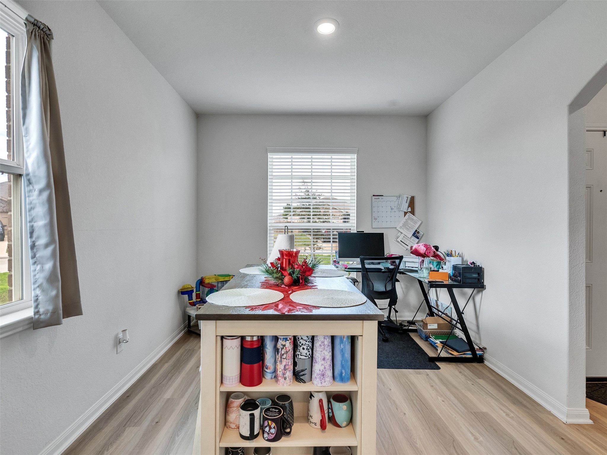 2123 Mule Ridge Drive Katy, TX 77493 - Photo 5 of 22 a view of a dining room with furniture window and wooden floor