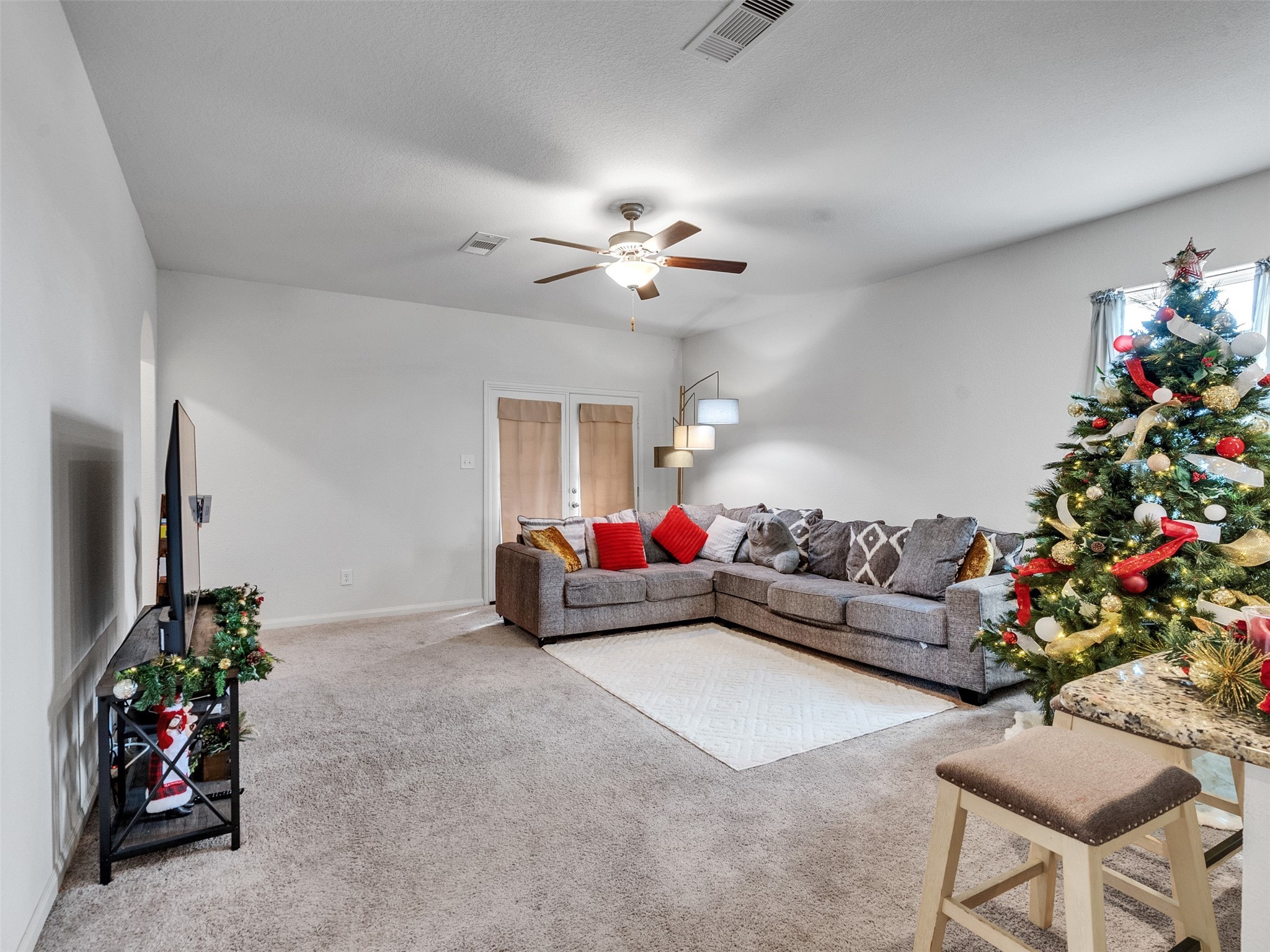 2123 Mule Ridge Drive Katy, TX 77493 - Photo 10 of 22 a living room with furniture and flowers