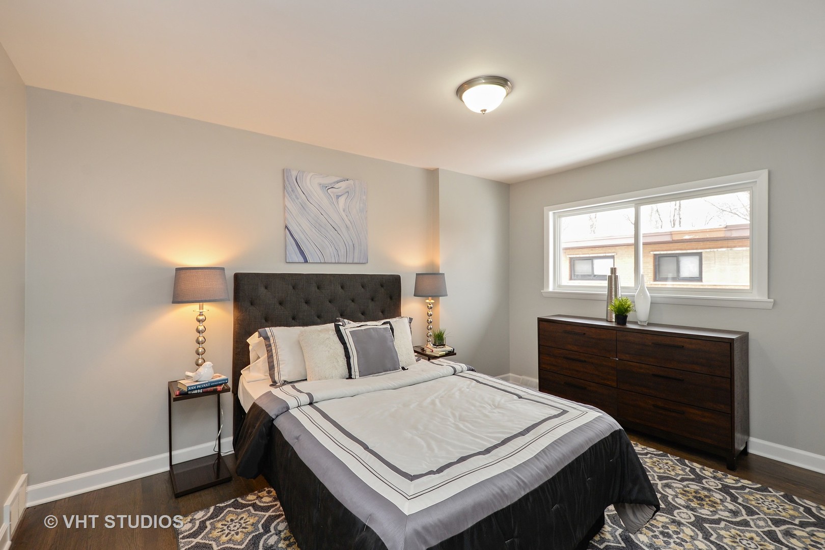 10077 Frontage Road, Unit E Skokie, IL 60077 - Photo 5 of 10 a bedroom with a bed and window