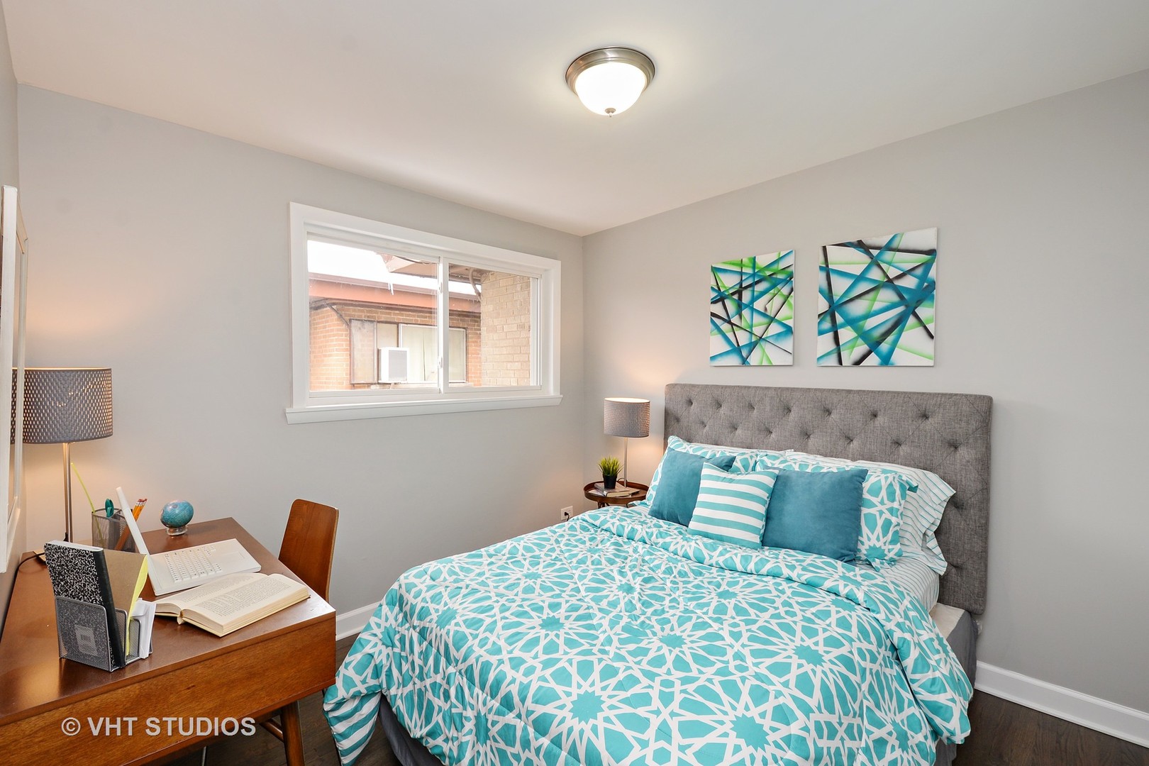 10077 Frontage Road, Unit E Skokie, IL 60077 - Photo 6 of 10 a bedroom with a bed and a window