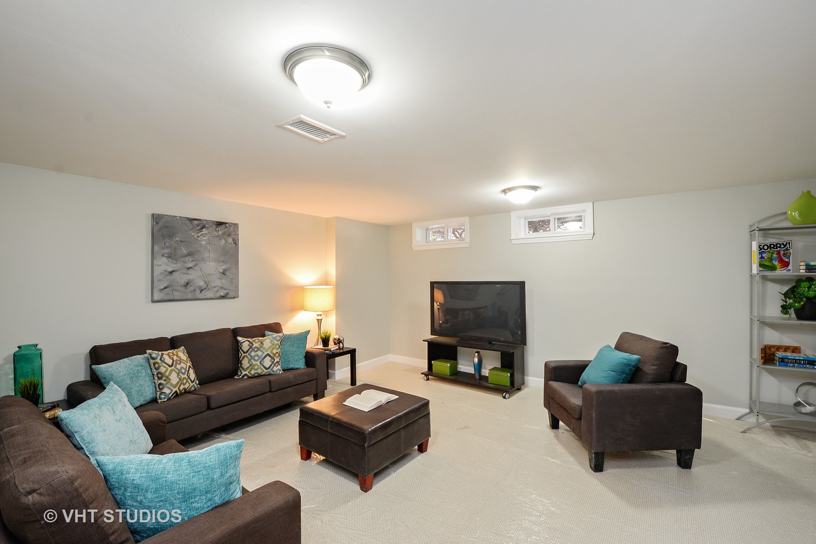 10077 Frontage Road, Unit E Skokie, IL 60077 - Photo 9 of 10 a living room with furniture and a flat screen tv