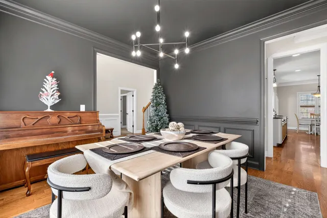 a kitchen that has a table and chairs in it