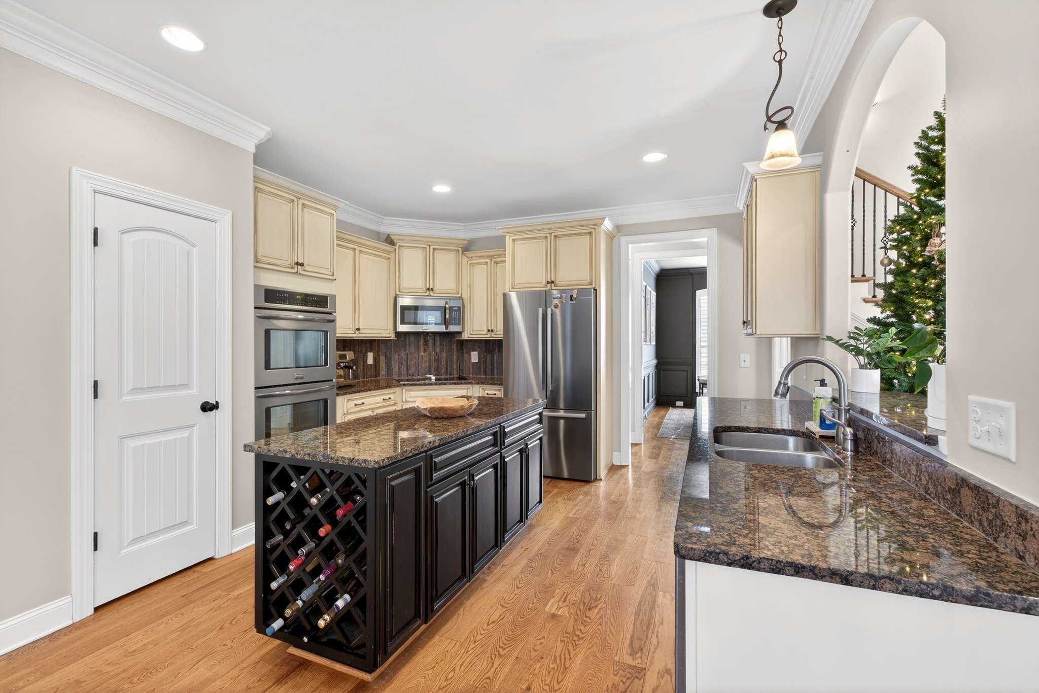 1007 Nealcrest Circle Spring Hill, TN 37174 - Photo 13 of 46 a kitchen with granite countertop a sink a counter top space stainless steel appliances and cabinets