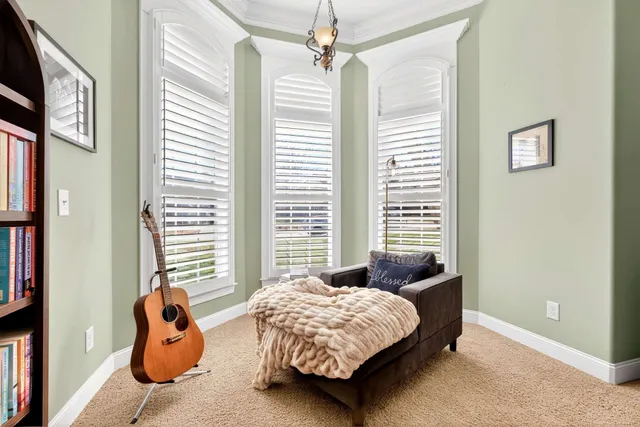 a bedroom with furniture and a window