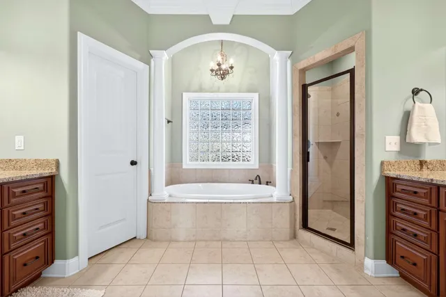 a spacious bathroom with a bathtub and a shower