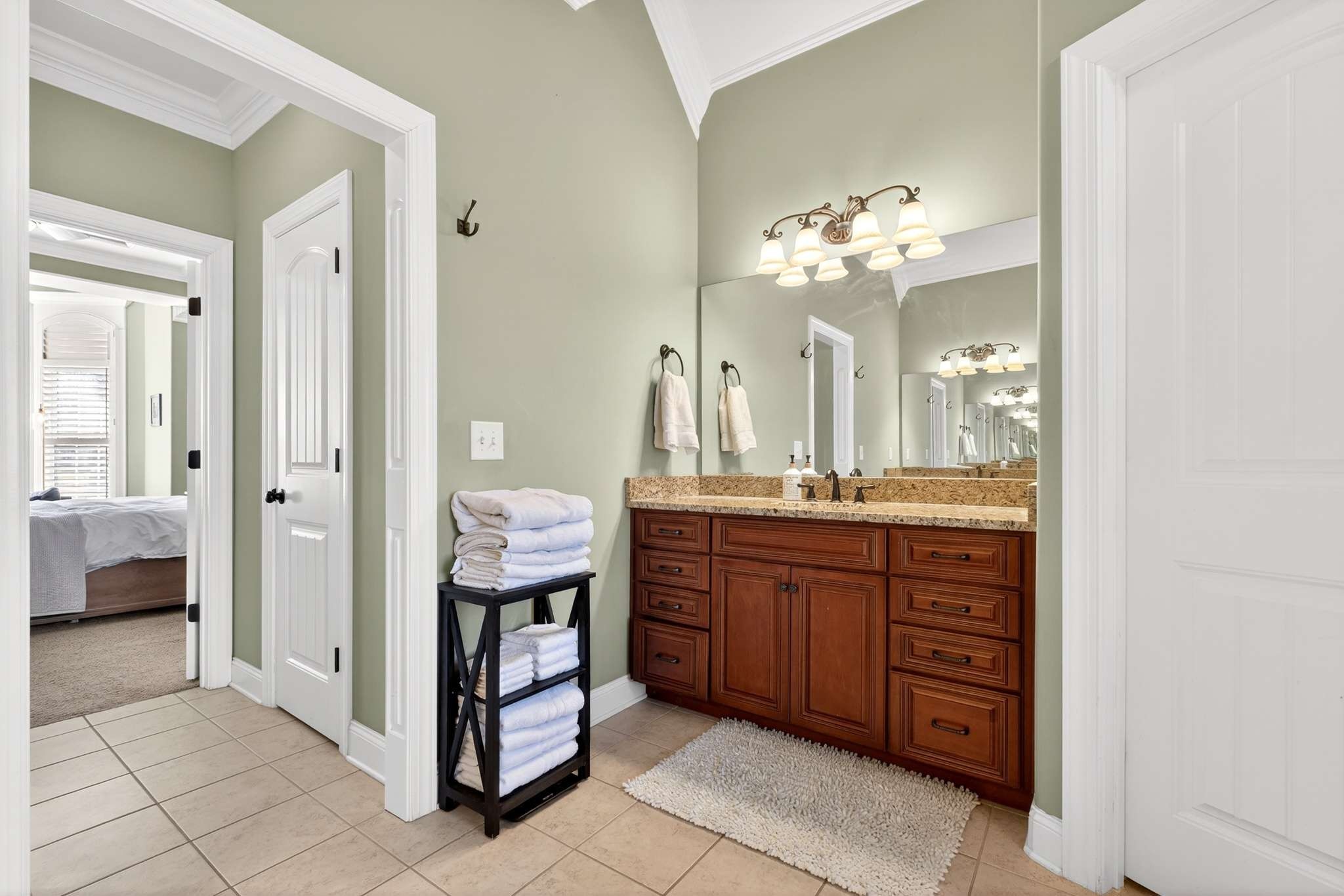 1007 Nealcrest Circle Spring Hill, TN 37174 - Photo 23 of 46 a spacious bathroom with a granite countertop sink a mirror and a bathtub