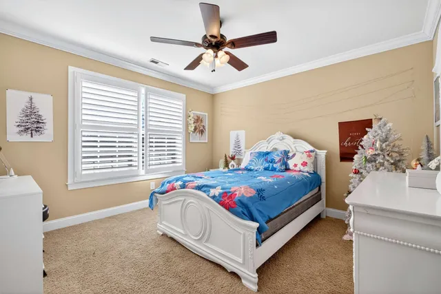 a bed room with a bed and a window