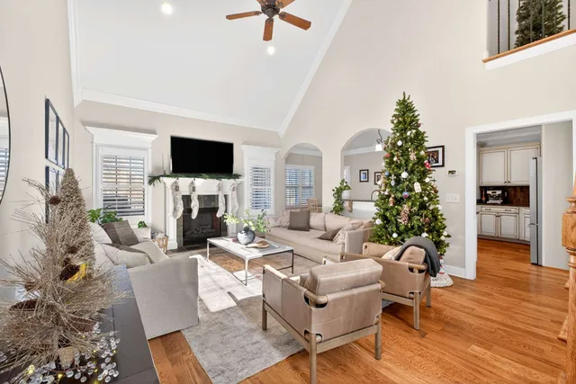 a living room with fireplace furniture and a flat screen tv