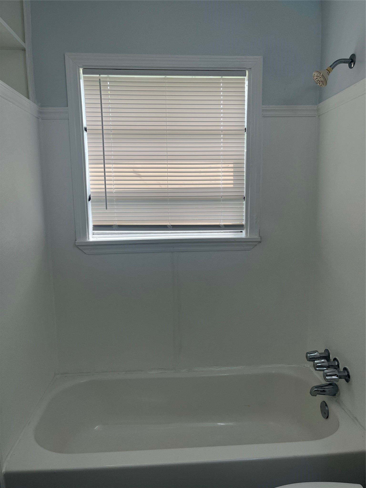 5537 Bataan Road, Unit B Houston, TX 77033 - Photo 11 of 13 a close up of a bathtub in a bathroom