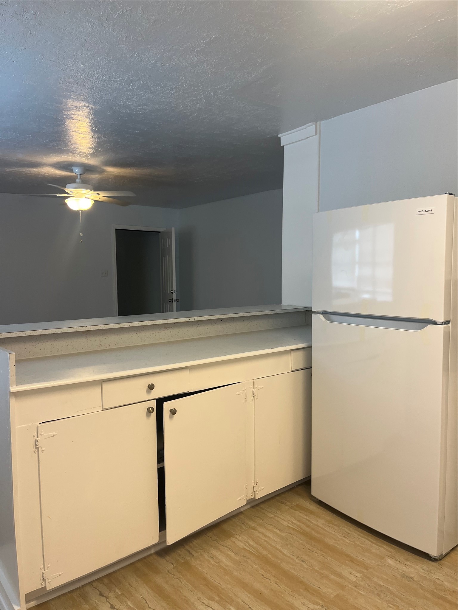 5537 Bataan Road, Unit B Houston, TX 77033 - Photo 3 of 13 a view of granite countertop cabinets and a refrigerator