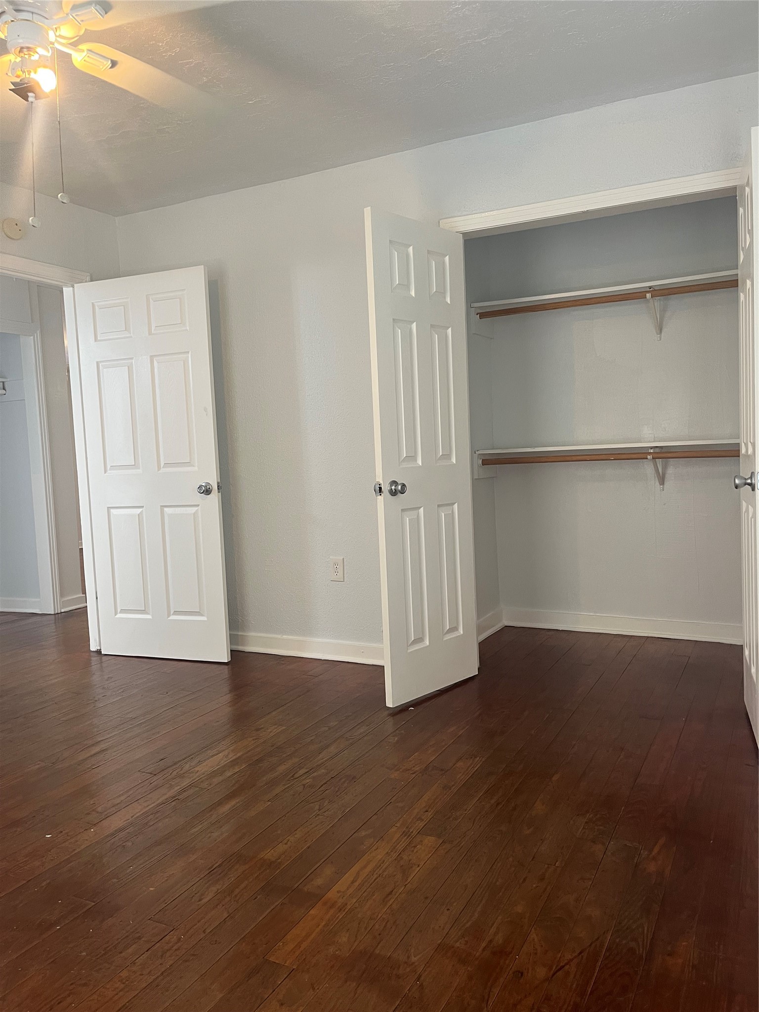 5537 Bataan Road, Unit B Houston, TX 77033 - Photo 6 of 13 a view of an empty room with wooden floor and closet