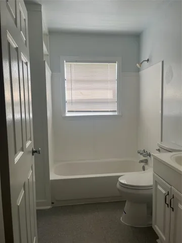 a bathroom with a toilet a sink and a bathtub