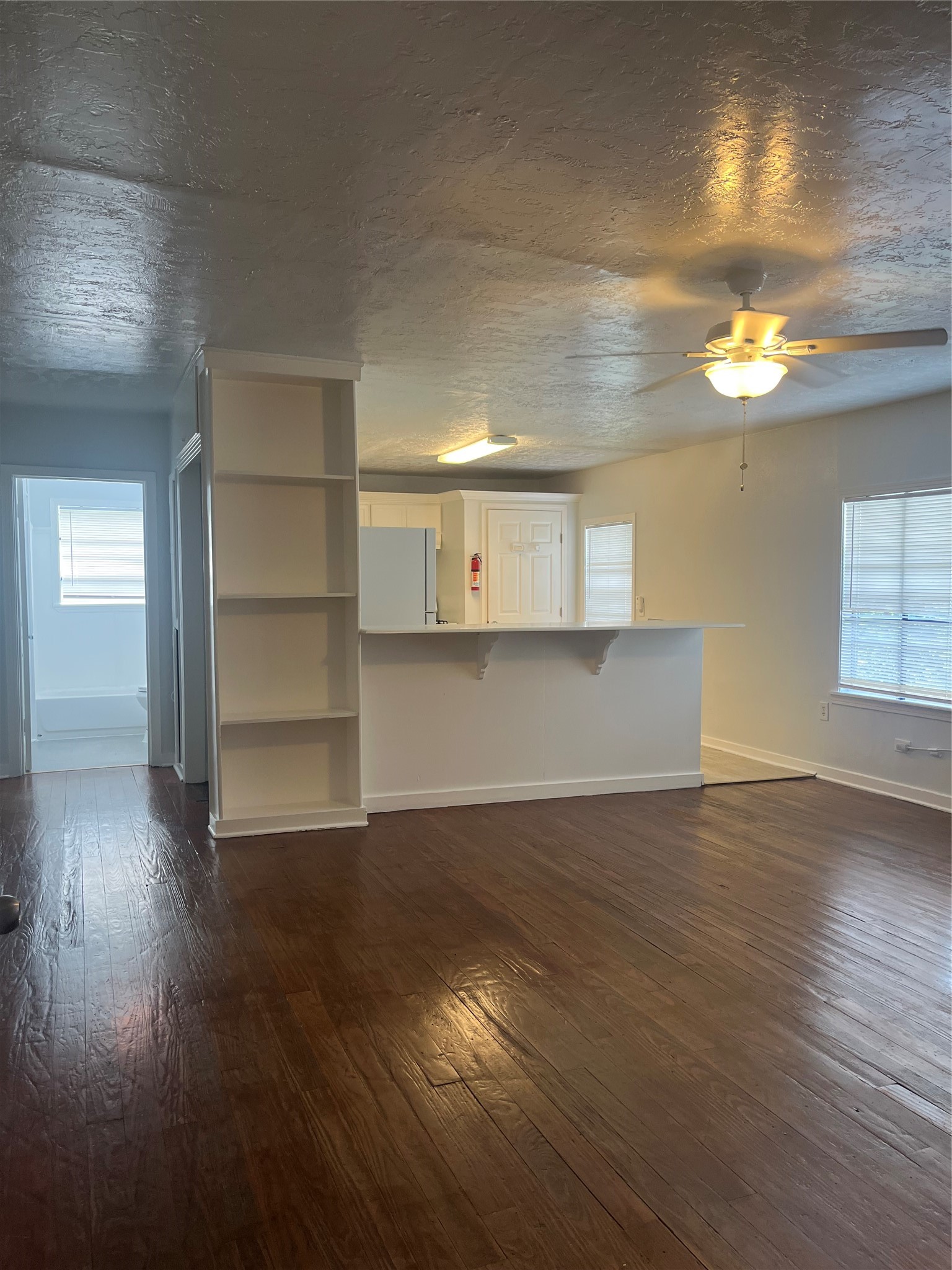 5537 Bataan Road, Unit B Houston, TX 77033 - Photo 8 of 13 a view of a room with wooden floor and window