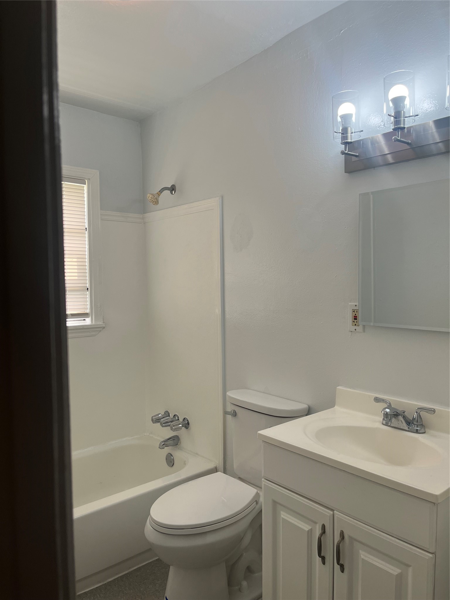 5537 Bataan Road, Unit B Houston, TX 77033 - Photo 9 of 13 a bathroom with a sink a toilet and shower